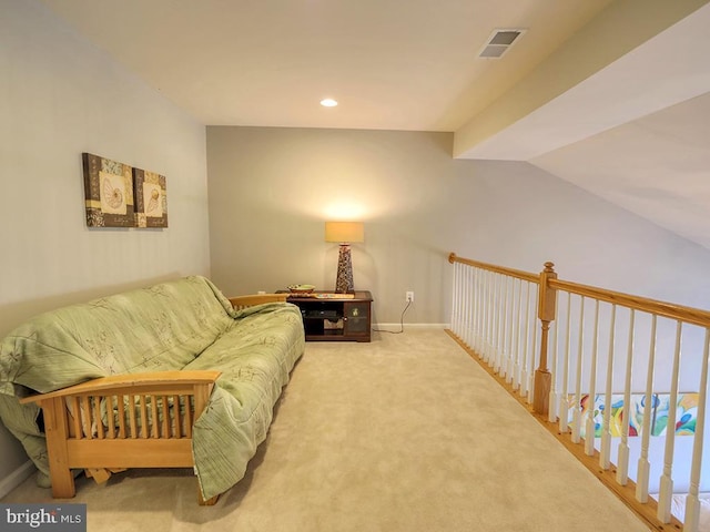 living area featuring visible vents, recessed lighting, carpet flooring, and baseboards