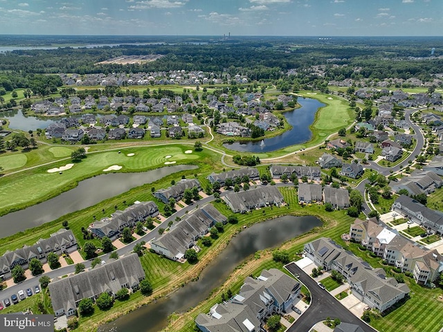 birds eye view of property featuring a residential view, golf course view, and a water view