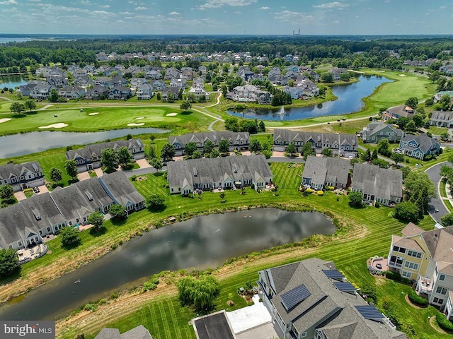 aerial view featuring a residential view, view of golf course, and a water view