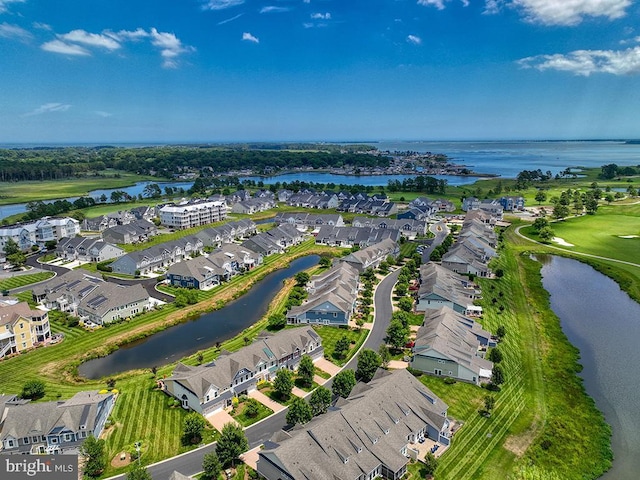 birds eye view of property with a residential view and a water view