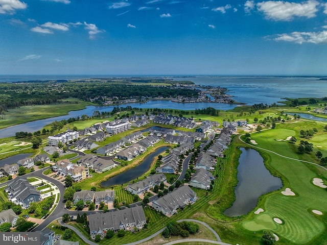 drone / aerial view featuring a residential view, a water view, and golf course view