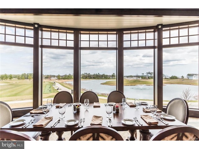 dining space featuring a water view