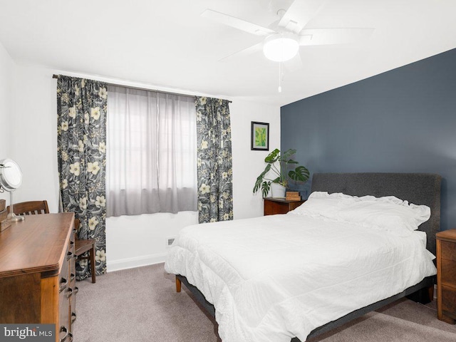 bedroom featuring carpet flooring, a ceiling fan, and baseboards