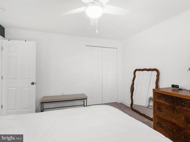 carpeted bedroom featuring a closet and a ceiling fan