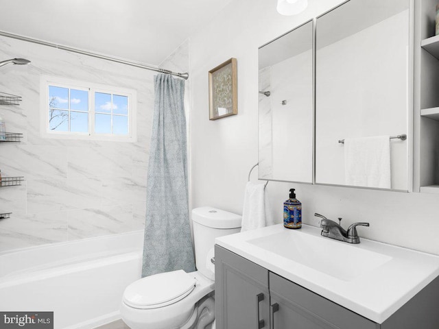 full bath with vanity, toilet, and shower / bath combo