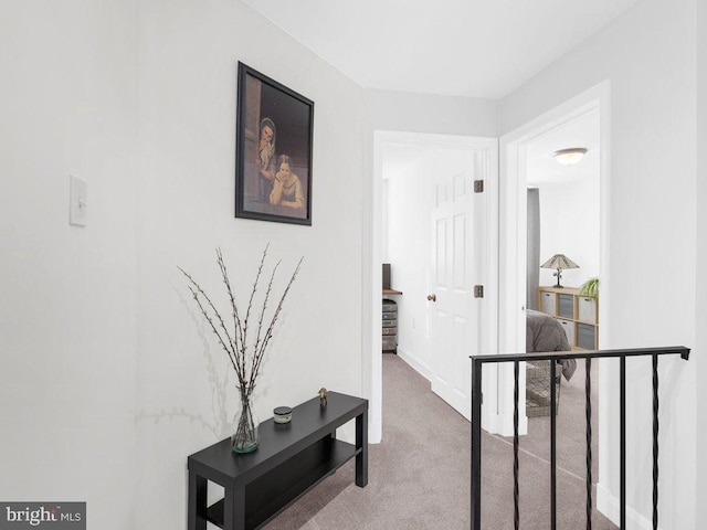 hallway with carpet flooring