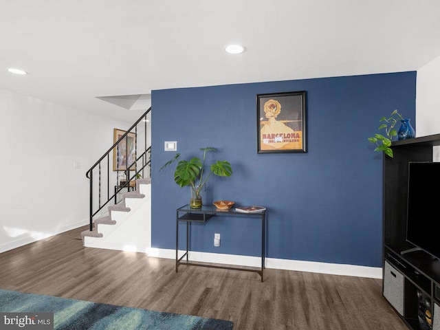 interior space featuring stairway, recessed lighting, baseboards, and wood finished floors