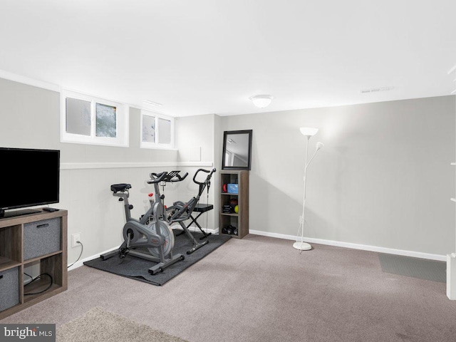 workout room featuring carpet flooring and baseboards