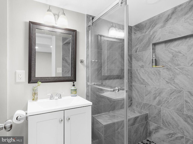 full bath featuring vanity and a stall shower