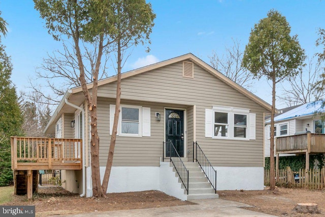 view of front of home featuring a wooden deck