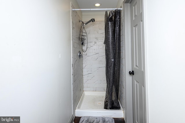 bathroom with a shower stall