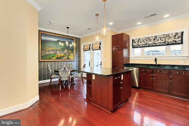 kitchen with dark countertops, visible vents, dark brown cabinets, dishwasher, and a sink