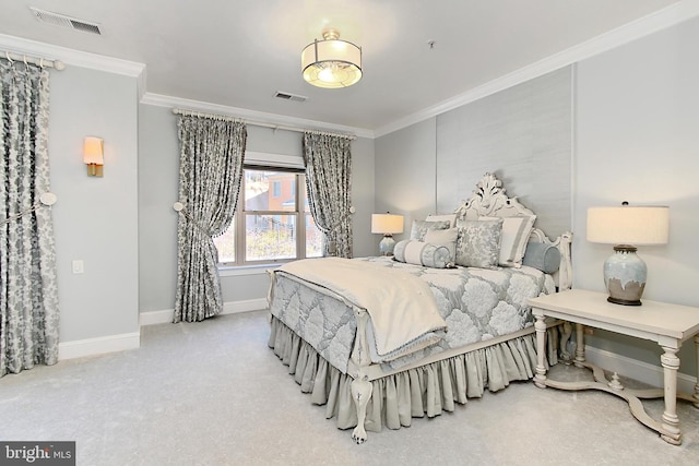 carpeted bedroom with crown molding, baseboards, and visible vents