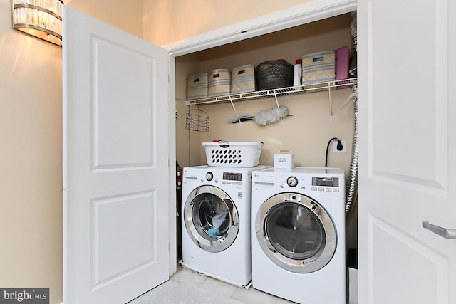 clothes washing area featuring laundry area and independent washer and dryer