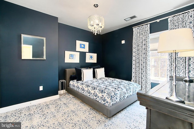 bedroom featuring visible vents, baseboards, speckled floor, and a chandelier