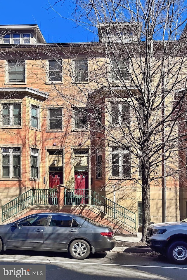 view of property featuring brick siding