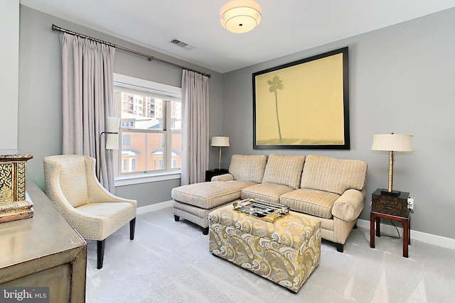 carpeted living room with baseboards and visible vents