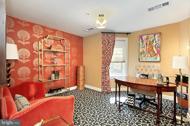 office area with visible vents and baseboards