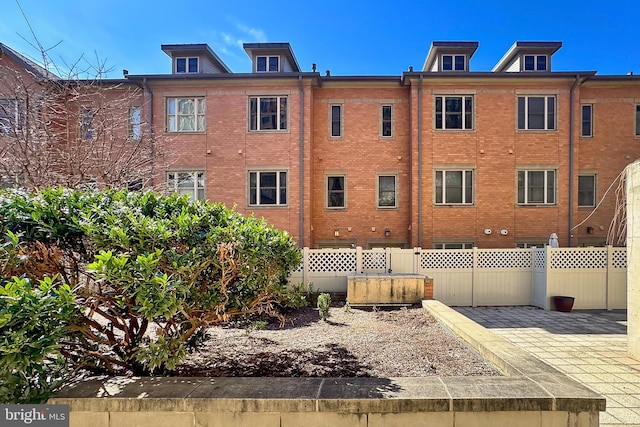 view of building exterior featuring fence