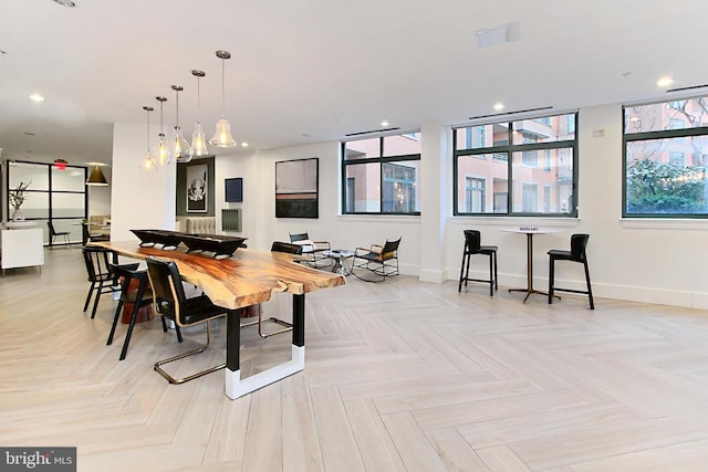 dining area with recessed lighting and baseboards