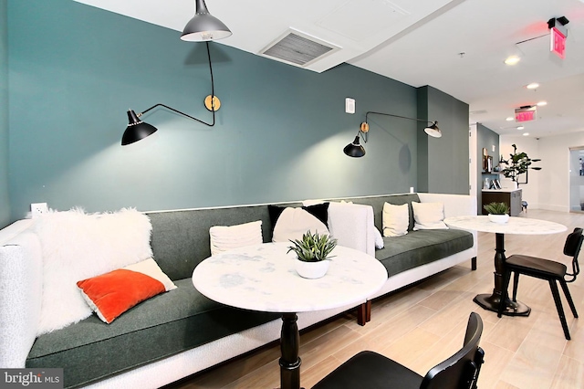 living area featuring recessed lighting and visible vents