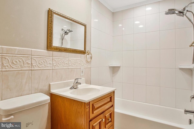 full bathroom featuring toilet, shower / bathing tub combination, tile walls, crown molding, and vanity