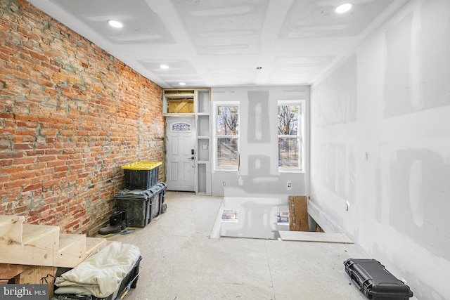 living room with brick wall