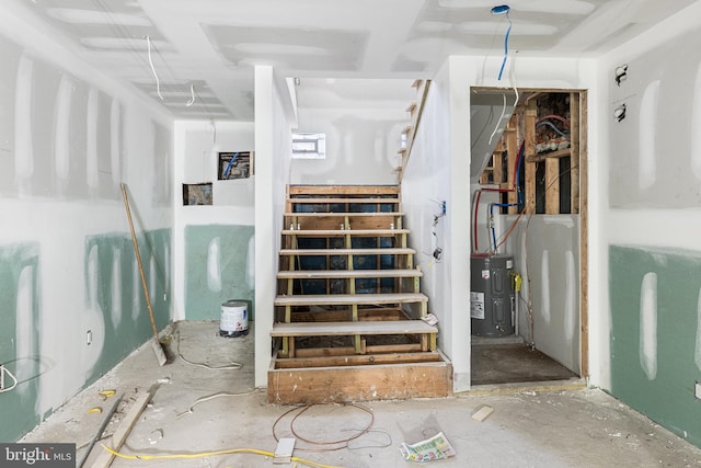 stairs featuring water heater