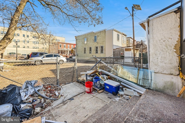 view of yard with a residential view and fence