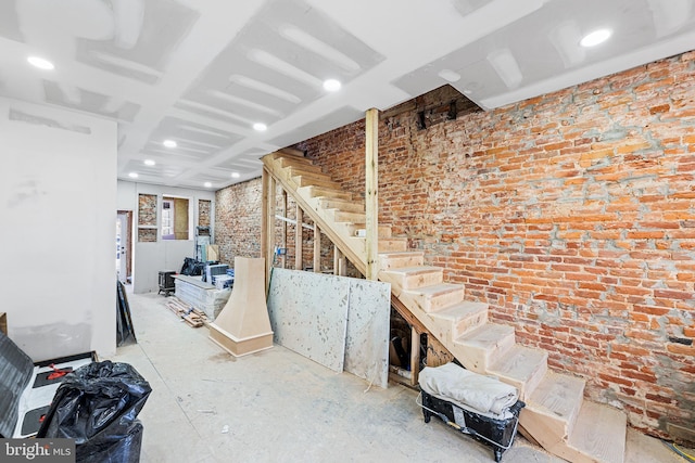 below grade area with brick wall and stairs