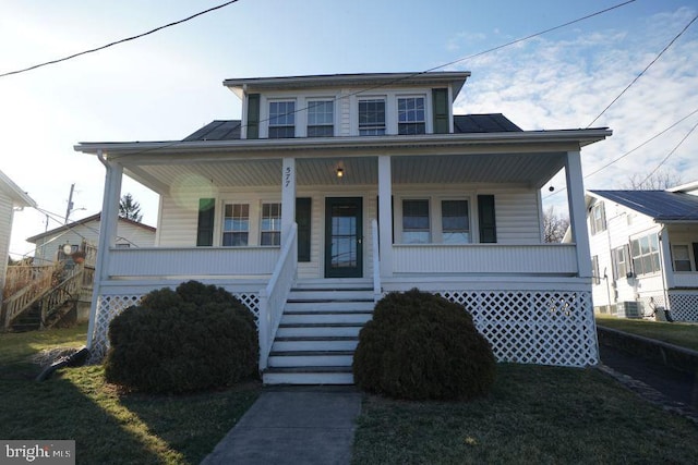 bungalow-style house featuring a front lawn, stairway, central AC unit, and covered porch