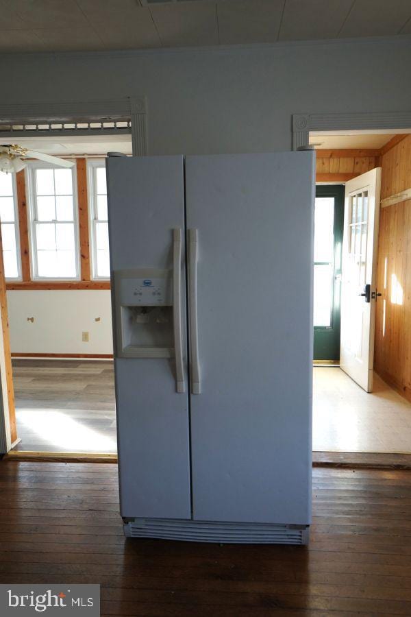 kitchen with plenty of natural light, wood-type flooring, and white fridge with ice dispenser