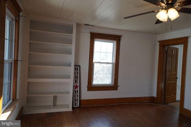 interior space featuring visible vents, baseboards, wood ceiling, hardwood / wood-style flooring, and a ceiling fan