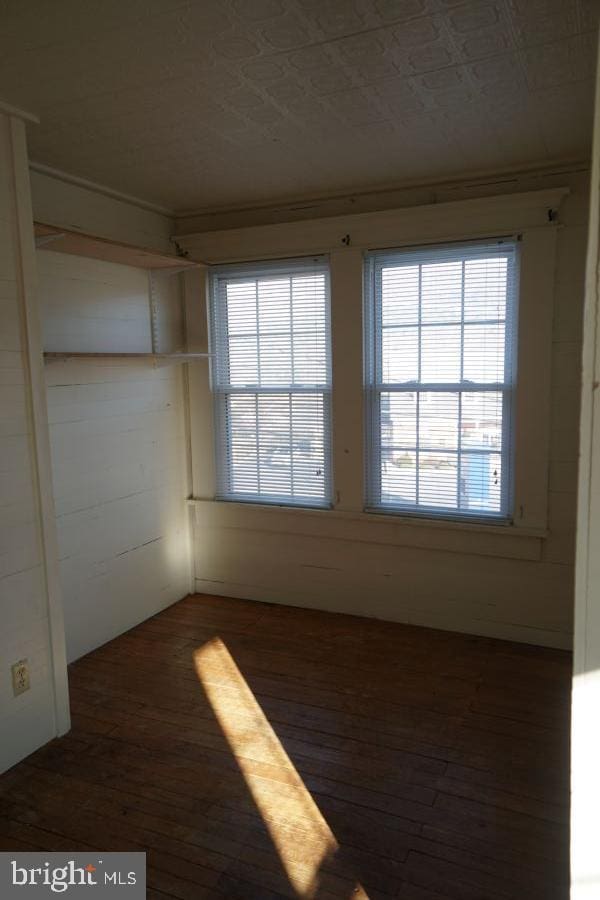 empty room featuring hardwood / wood-style floors