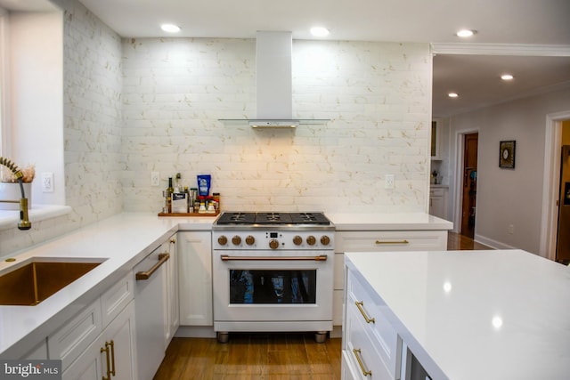 kitchen featuring a sink, light countertops, wall chimney range hood, and white gas range oven