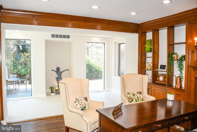 sitting room with recessed lighting, visible vents, and wood finished floors