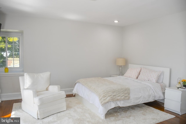 bedroom featuring recessed lighting, wood finished floors, and baseboards