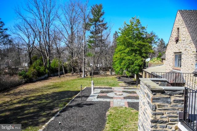 view of yard with a patio area and a fire pit