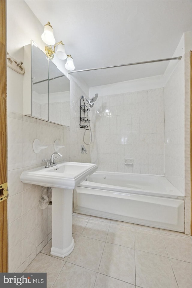 bathroom with tile patterned floors, tile walls, and shower / bathtub combination