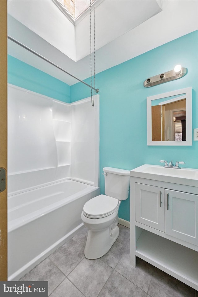 full bath with toilet, a skylight, shower / bathing tub combination, tile patterned floors, and vanity