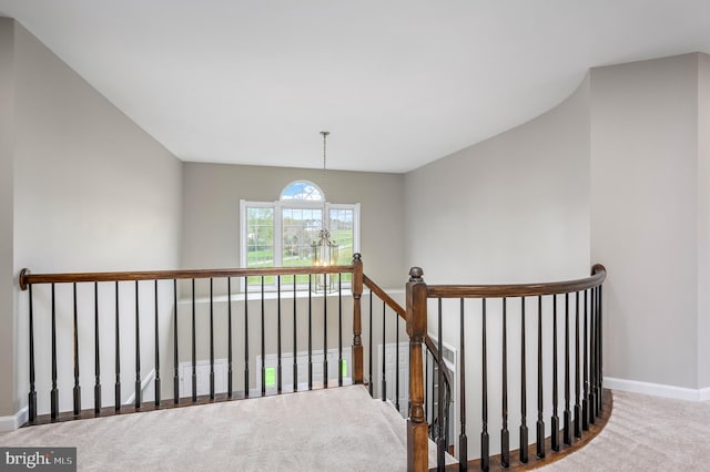 stairway with carpet floors and baseboards