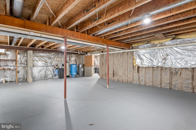 unfinished below grade area with electric water heater