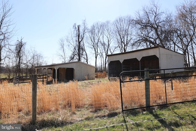 view of pole building featuring fence