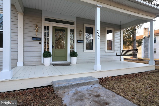 property entrance with covered porch