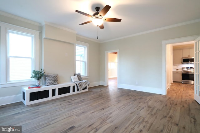 mudroom with ceiling fan, baseboards, light wood-type flooring, and ornamental molding