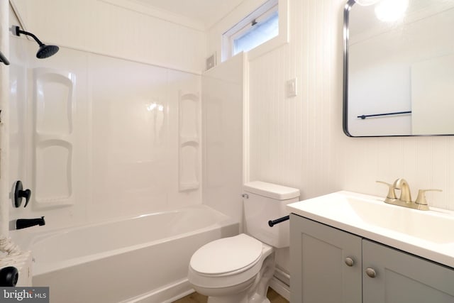 bathroom with toilet, ornamental molding, vanity, and shower / tub combination