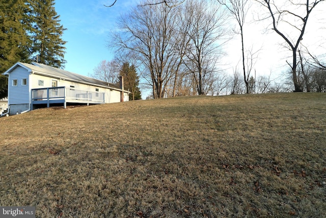 view of yard featuring a wooden deck