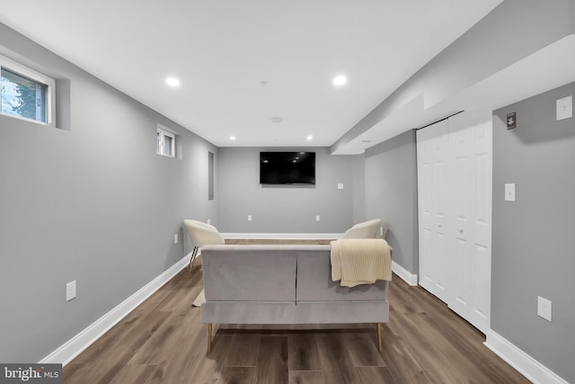 interior space featuring dark wood finished floors, recessed lighting, and baseboards