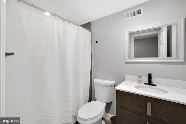 full bath featuring visible vents, toilet, and vanity