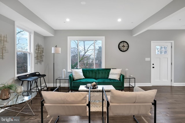 living area featuring recessed lighting, plenty of natural light, wood finished floors, and baseboards